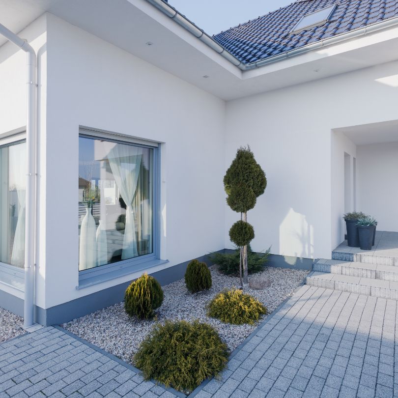 Local plasterer finishing a living room wall